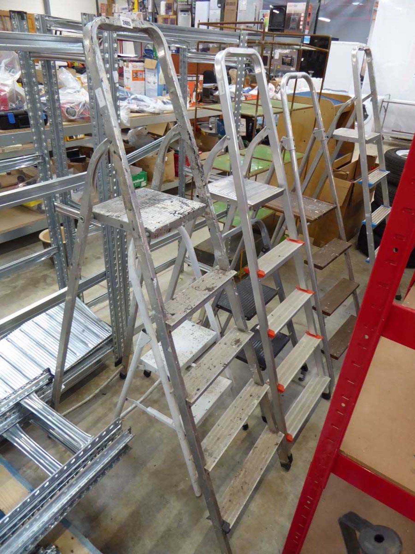 5 various sized aluminum step ladders