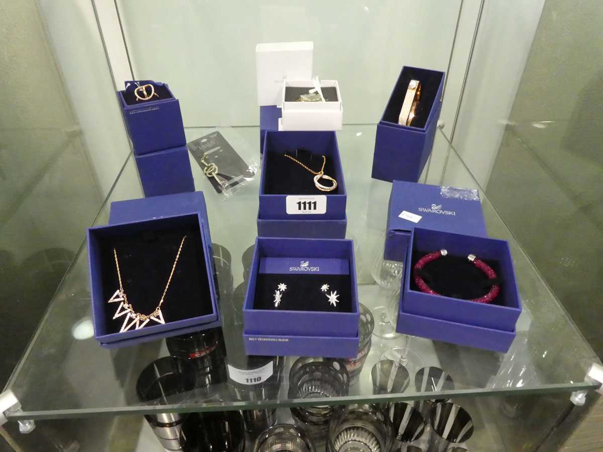 Shelf containing Swarovski jewellery (mostly boxed)