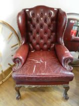 Red club chair upholstered in the Chesterfield manner Cushion requires re-upholstering