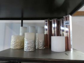 +VAT Shelf containing various candles