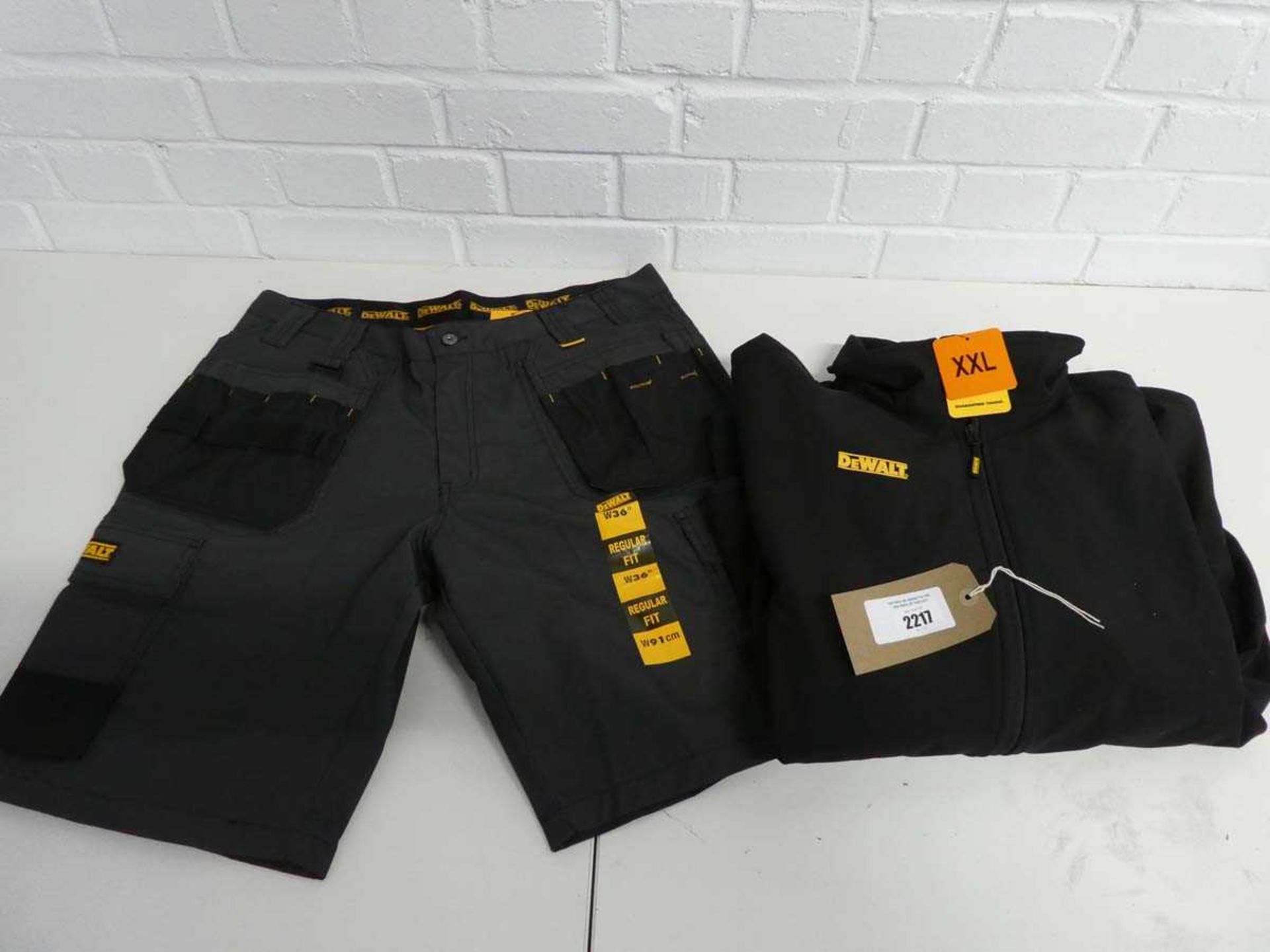 +VAT Pair of DeWalt multi-pocket work shorts, size W:36, together with a DeWalt black zip-up long