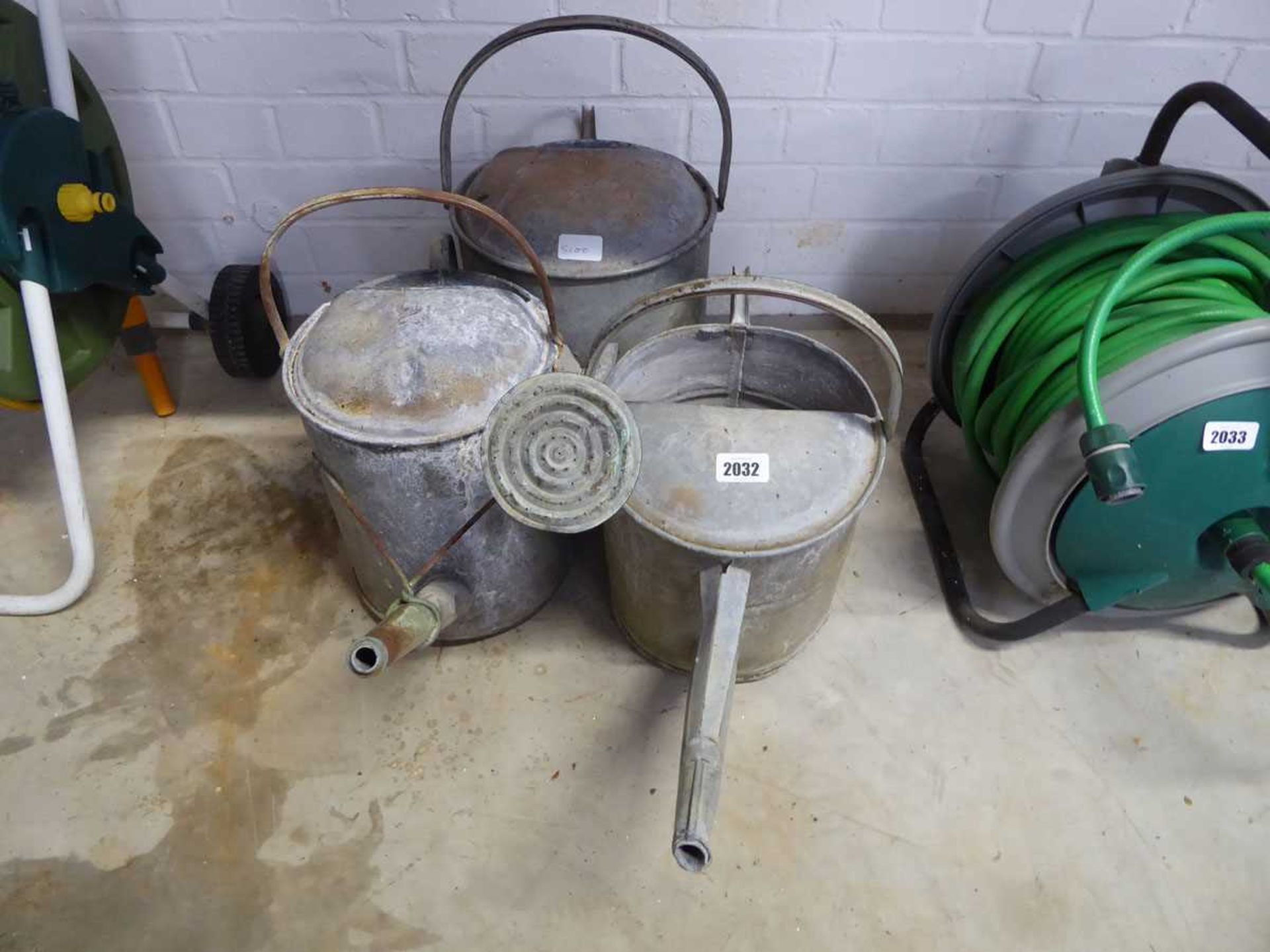 3 galvanised watering cans