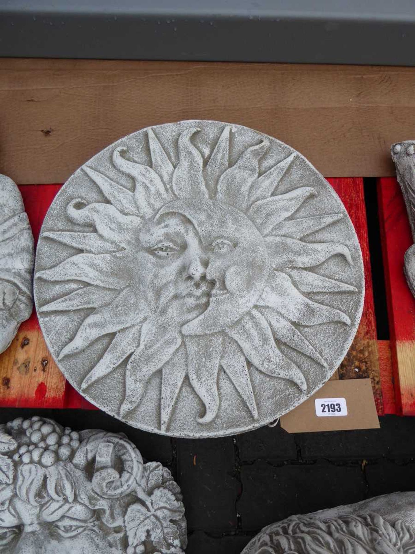 Sun and moon concrete plaque