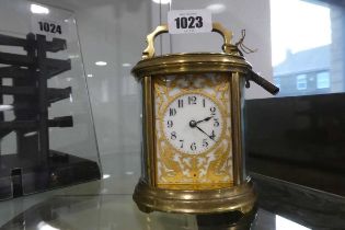 Brass cased oval carriage clock