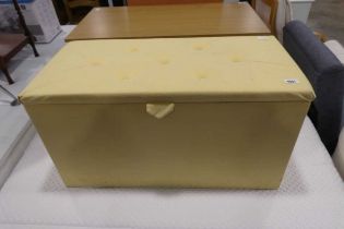 Yellow upholstered ottoman