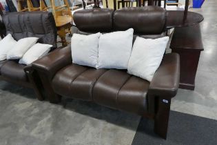 Brown leather upholstered reclining sofa on mahogany effect frame with 3 natural coloured cushions