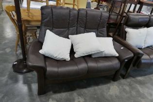 Brown leather upholstered reclining sofa on mahogany effect frame with 3 natural coloured cushions