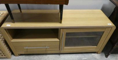 Light oak finish entertainment unit with single glazed door and single drawer