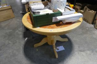 Circular single pedestal tile top extending dining table