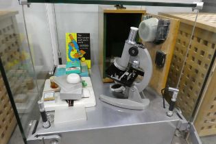 Cased microscope with variety of various accessories