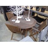 Teak circular garden table with 4 matching teak folding garden chairs