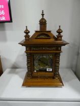 Dark oak cased mantle clock with decorative gilt and brass decorations