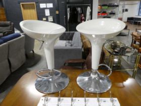 2 pairs of white plastic bar stools on chrome bases