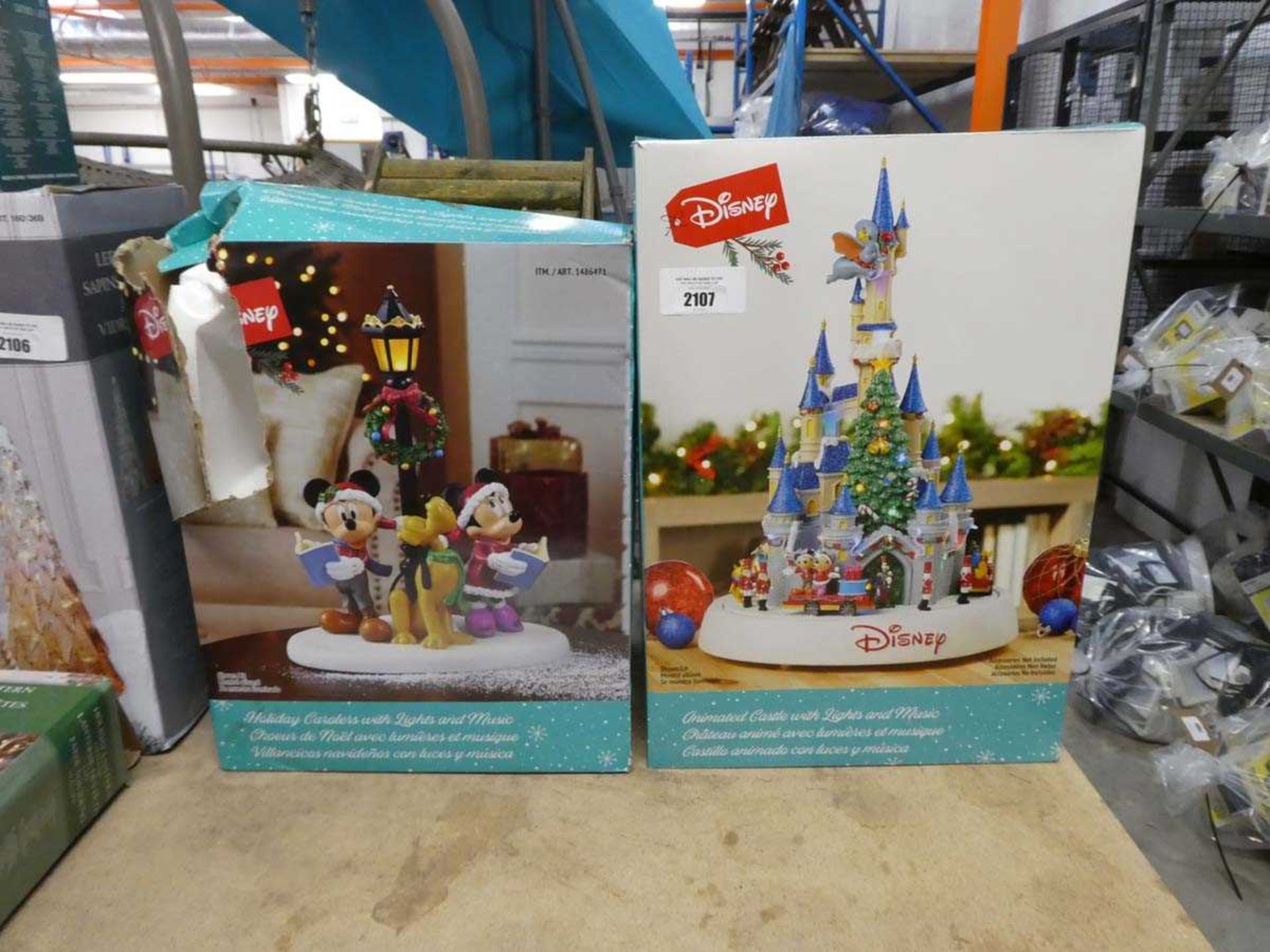 +VAT Disney animated light up castle, together with a Disney holiday carolers set