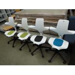 4 assorted coloured white plastic swivel chairs