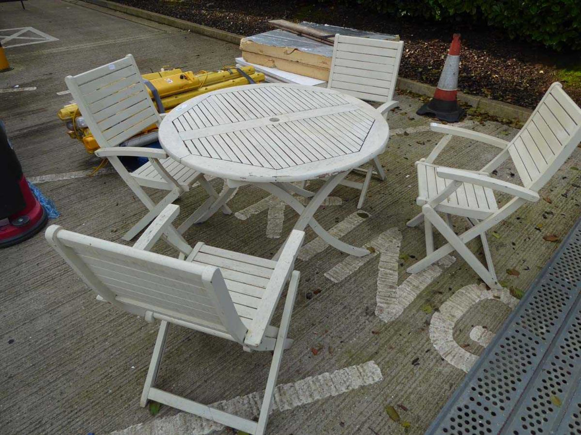 Round wooden garden table and four chairs