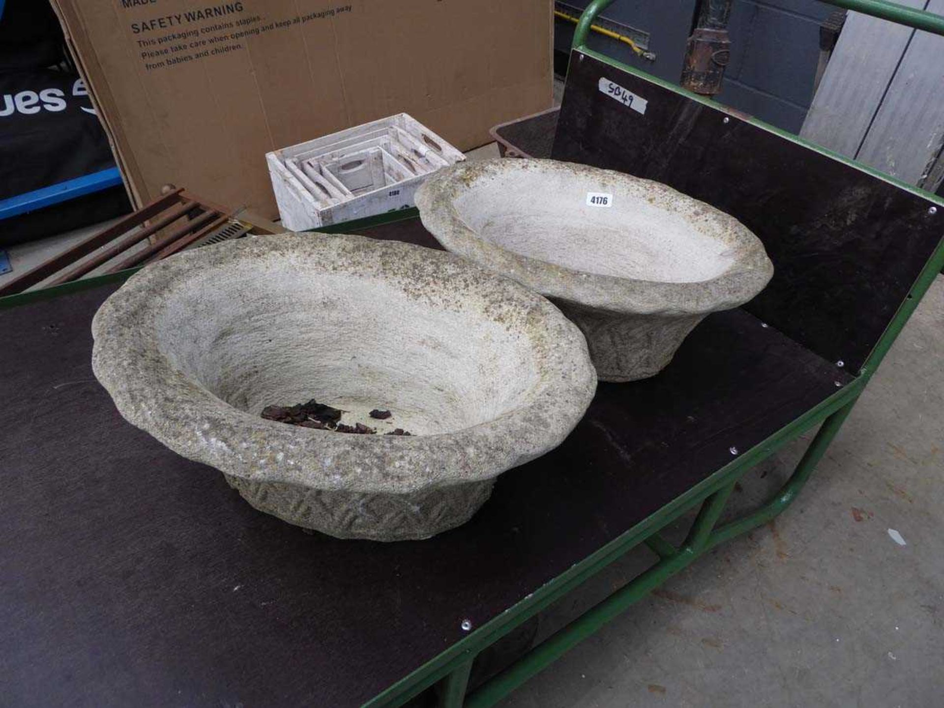 Two concrete oval pots
