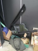 Large quantity of fishing tackle to include rods, folding chairs, umbrella and various tackle