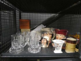 Cage containing toby jugs, glass tankards and doylies