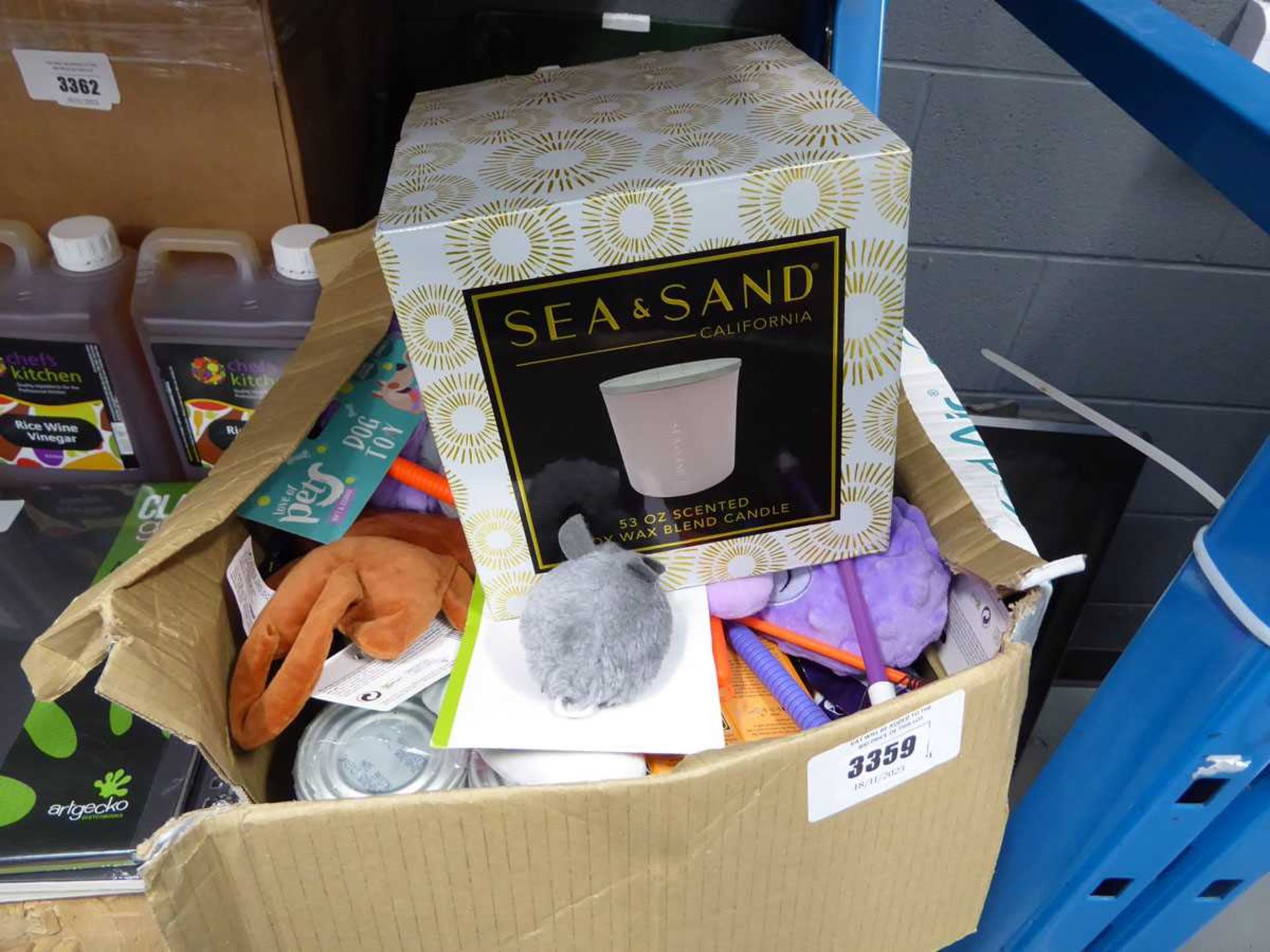 +VAT Box of mixed items inc. pet toys, pet food and sea and sand scented candle