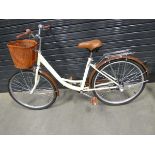 Brown and beige girls bike with front basket