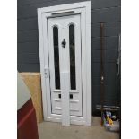 White UPVC part glazed door