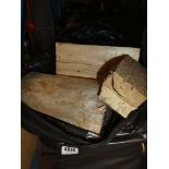 4 black bags of wooden logs