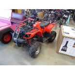 Red petrol powered quad bike