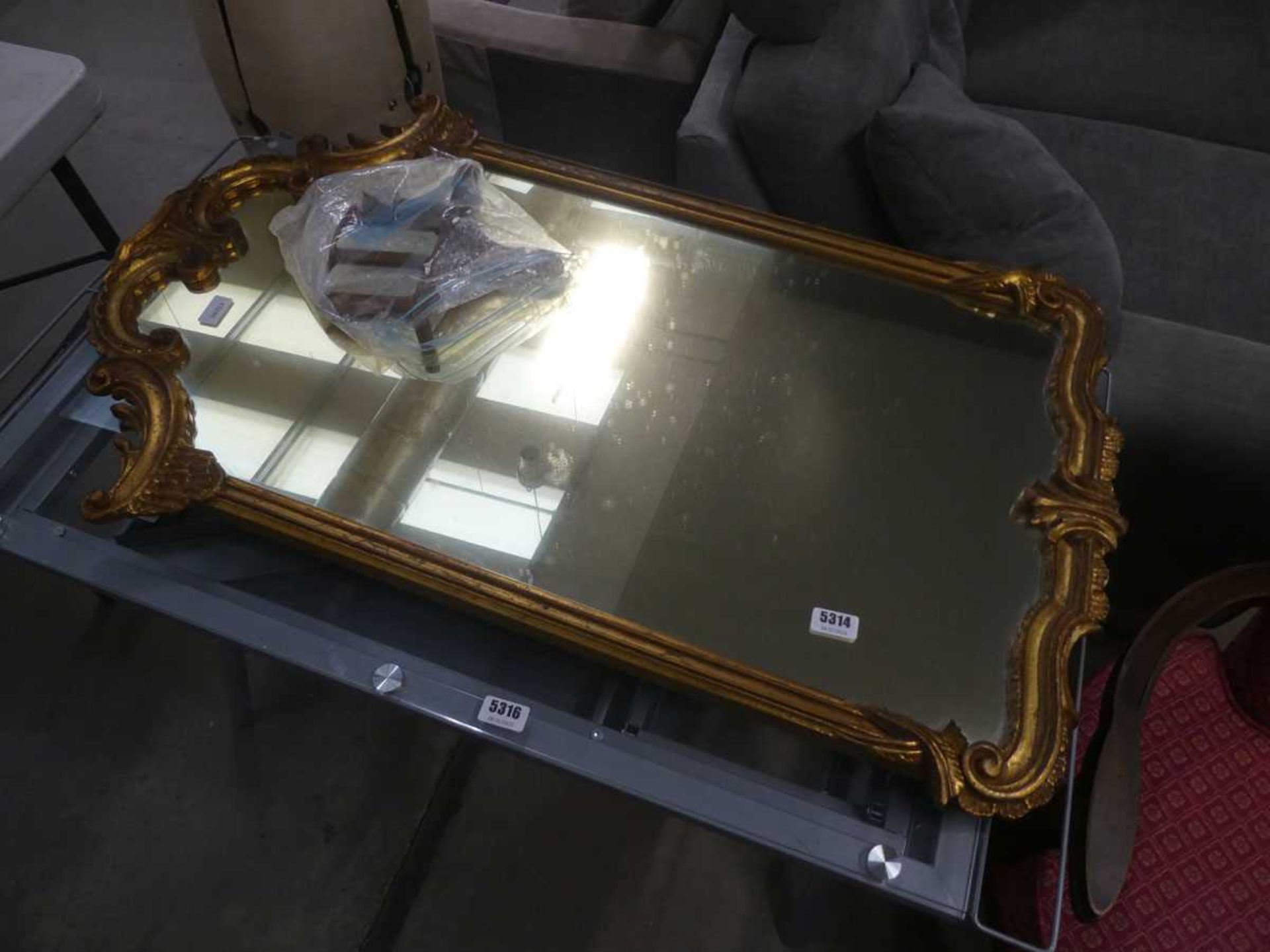 Mirror in ornate gilt frame