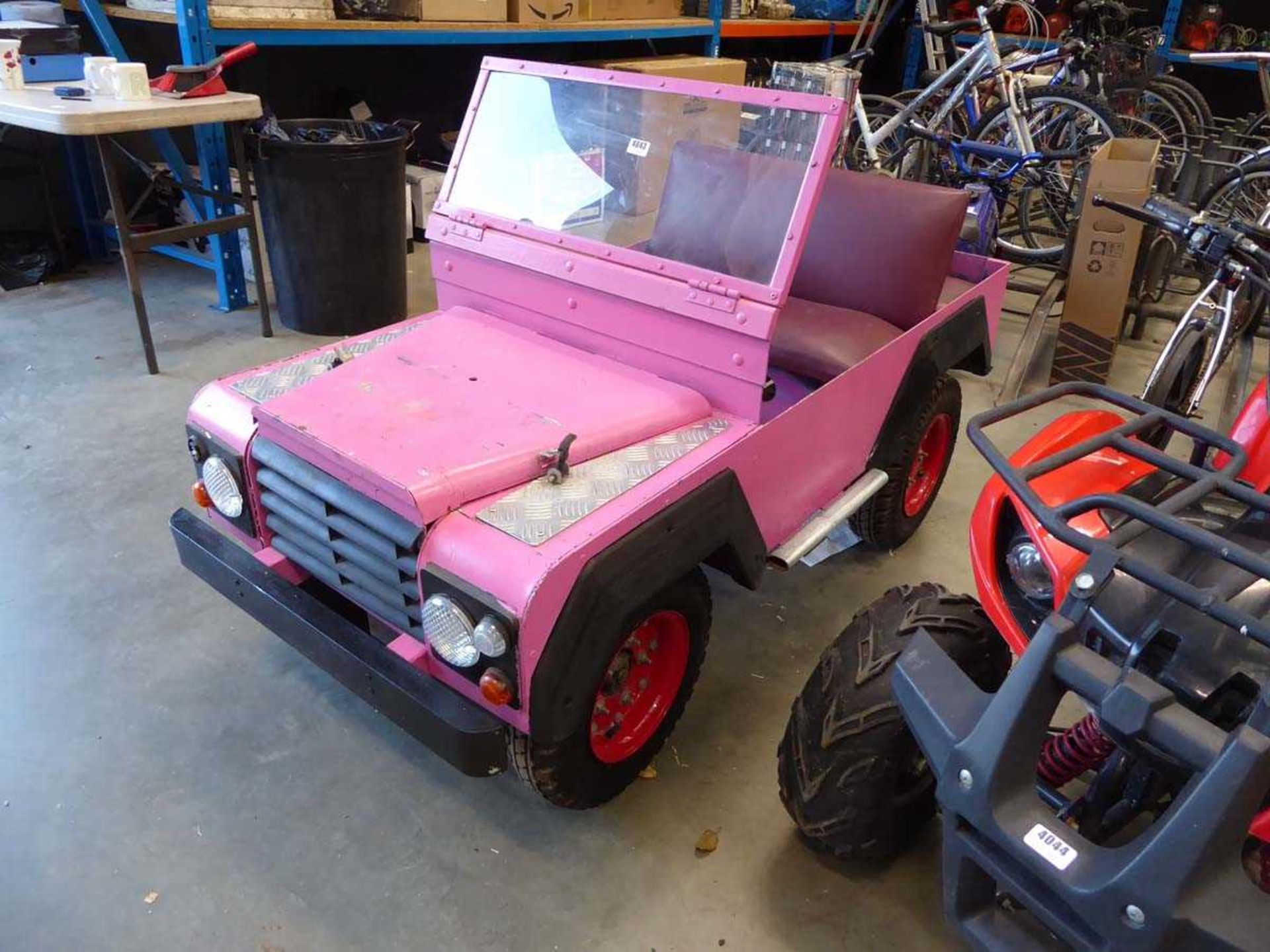 Petrol powered 4-wheel child's pink Landrover style car