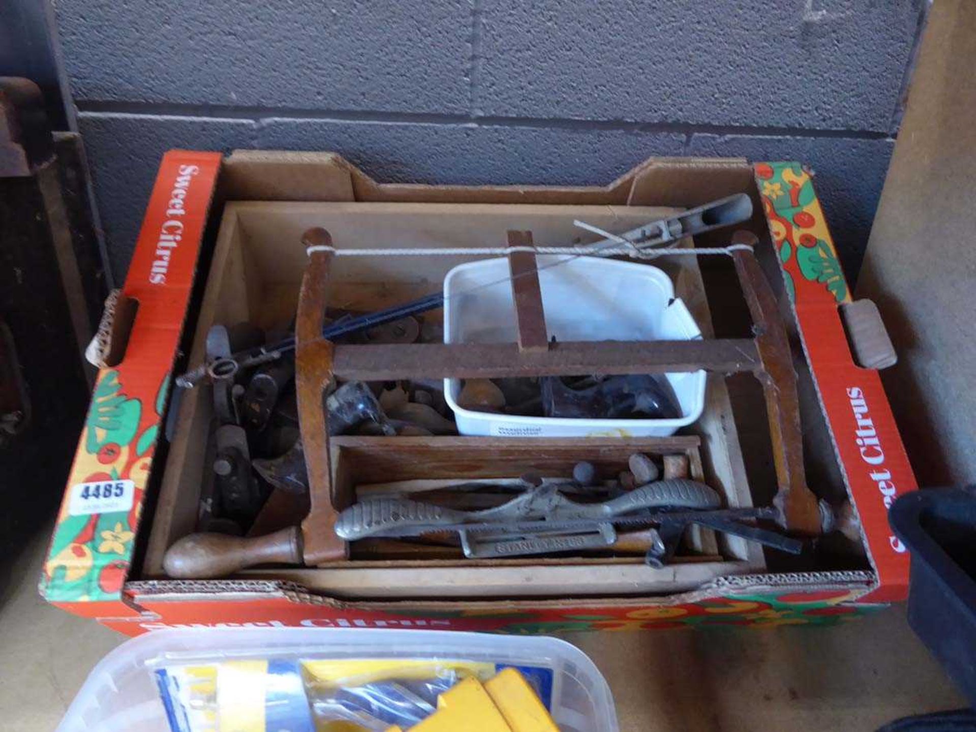 Box containing cabinet scraper, planer parts, bow saw, hacksaw etc.