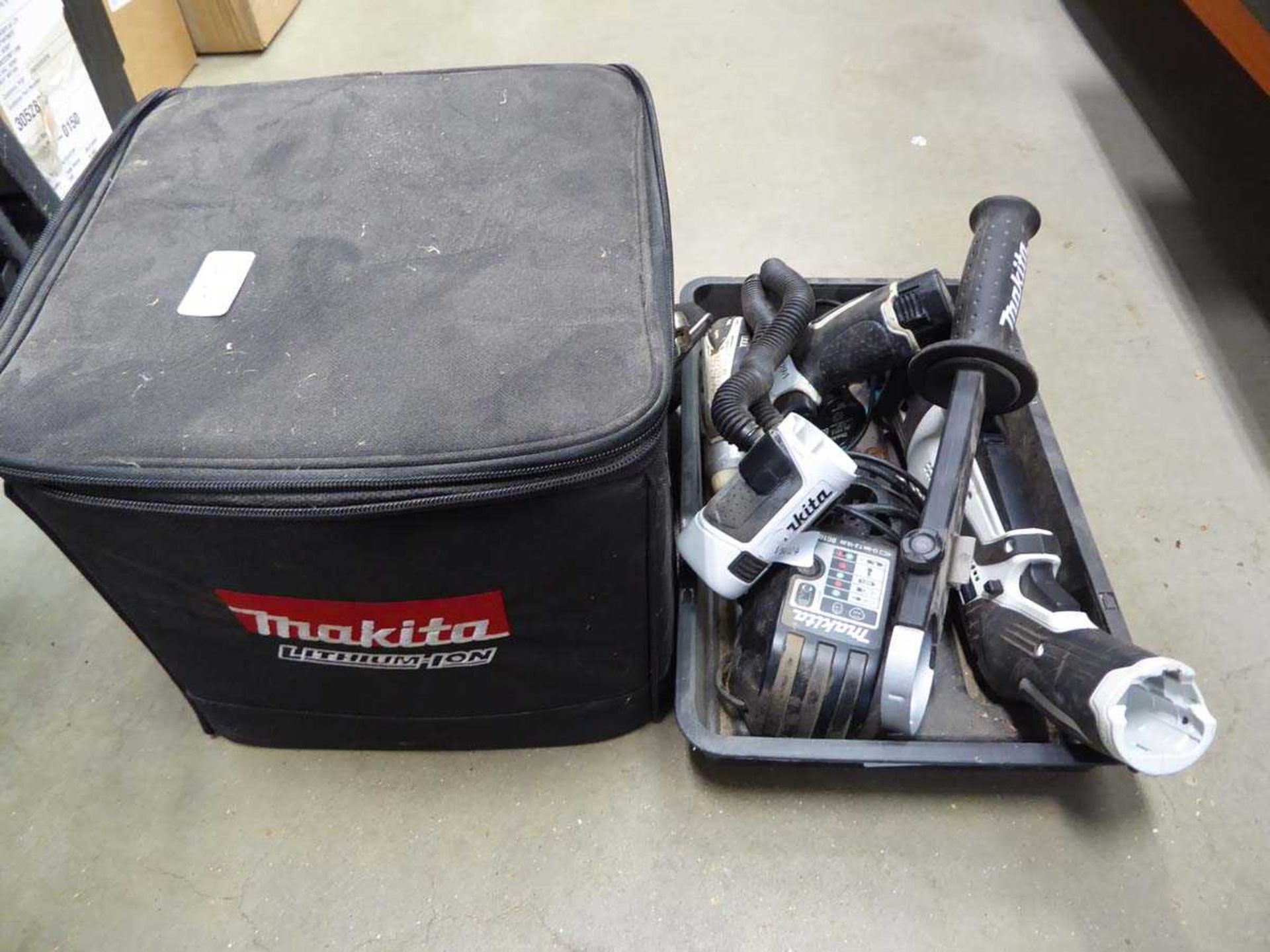 Makita reciprocating cordless saw, torch, and drill driver, together with 3 batteries and charger