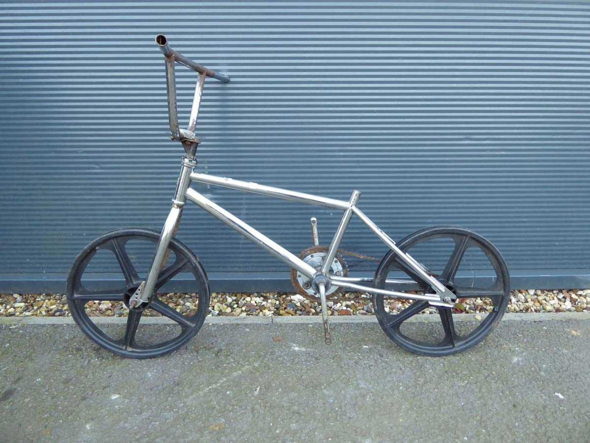 BMX chrome bike frame, plastic wheels (no seat or pedals)