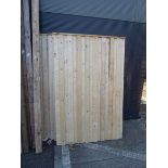 Four wooden fence panels and posts