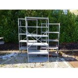 Three grey metal racks