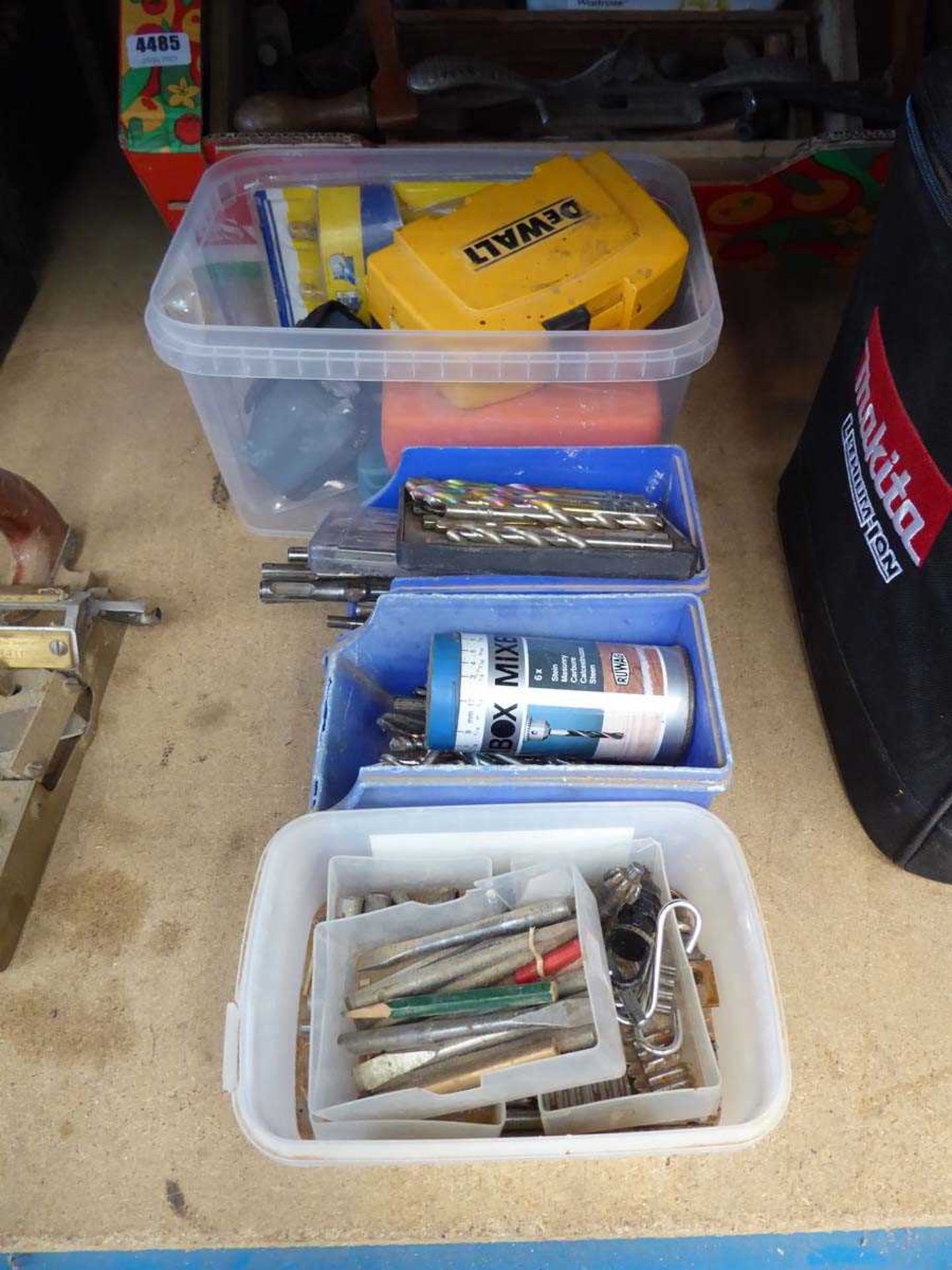 4 containers of miscellaneous drill bits, measuring devices, etc.