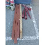 Four wooden fence posts and fence stakes