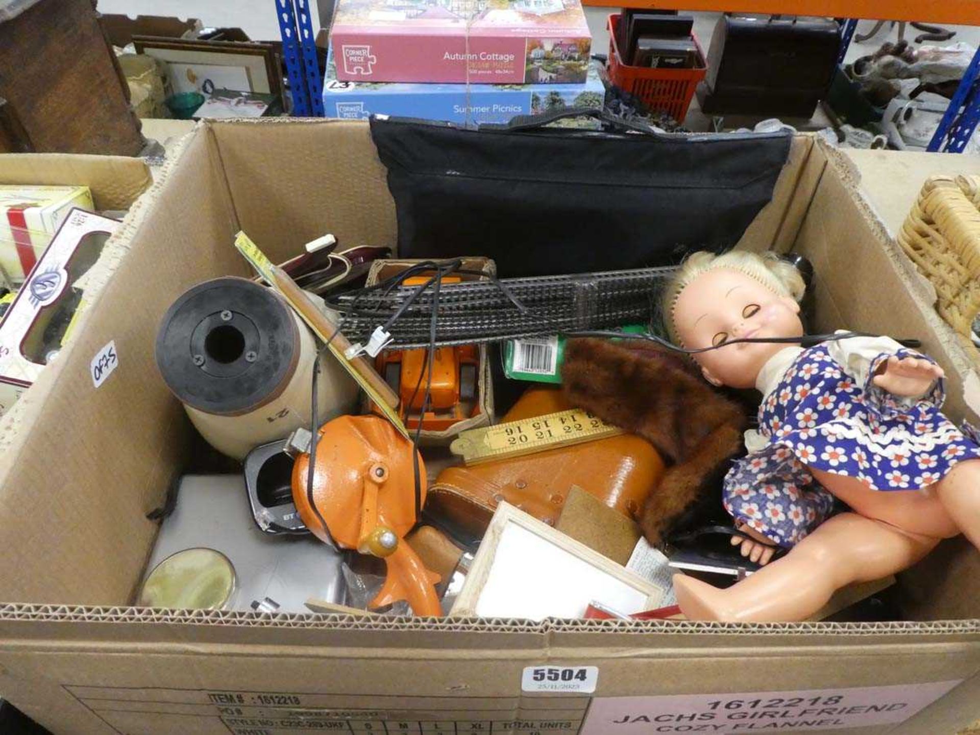 Box containing binoculars, ornaments, doll, train track and household goods