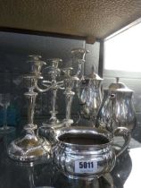 (9) 6 pieces of silver plate to include teapots, candlesticks and a sugar bowl