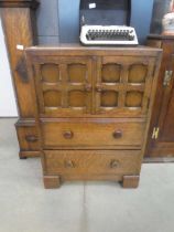 Oak double door cabinet with drawers under