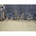Two gents mountain bikes, one blue and one black and grey, seat missing
