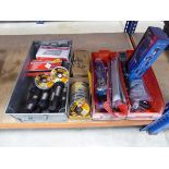 Quarter of an underbay containing bolts, DeWalt cut off discs, socket sets and wrenches and