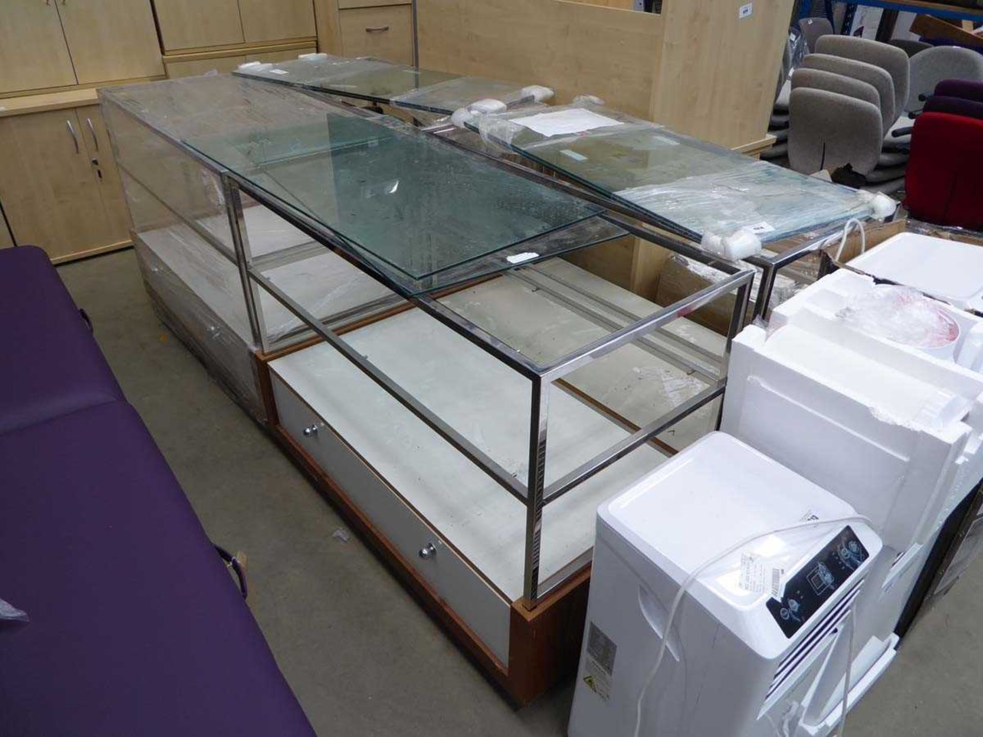 Four large glass display cabinets