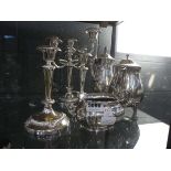 (4) 6 pieces of silver plate to include teapots and candlesticks and a sugar bowl