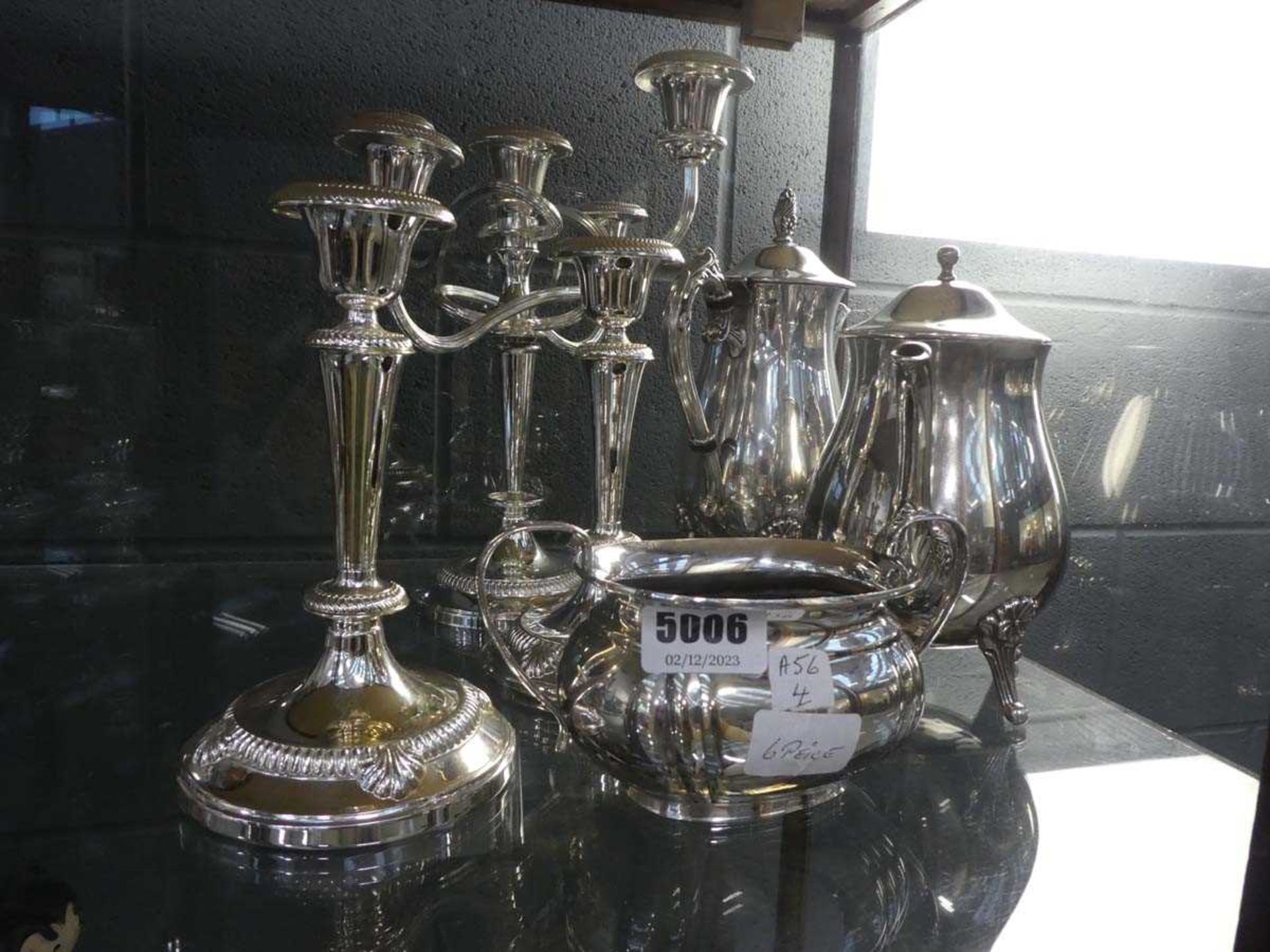 (4) 6 pieces of silver plate to include teapots and candlesticks and a sugar bowl