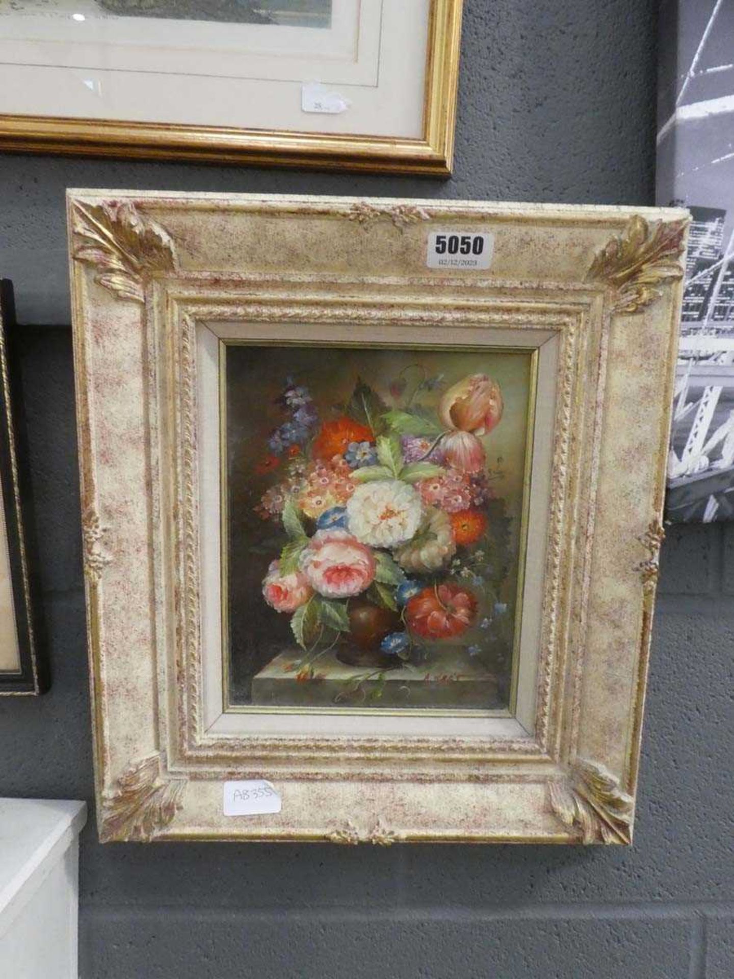 Still life with flowers in ornate frame