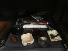 Cage containing glass and other ash trays, hip flask, The Playmate Book, Pirelli Calendar book,