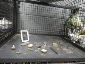 Cage containing cameo brooches, coinage and photoframe