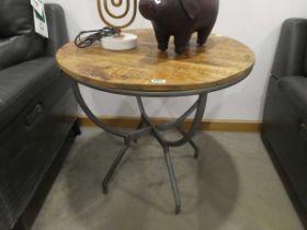 Circular pine table on cast iron base