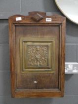 Oak panel with floral brass centre